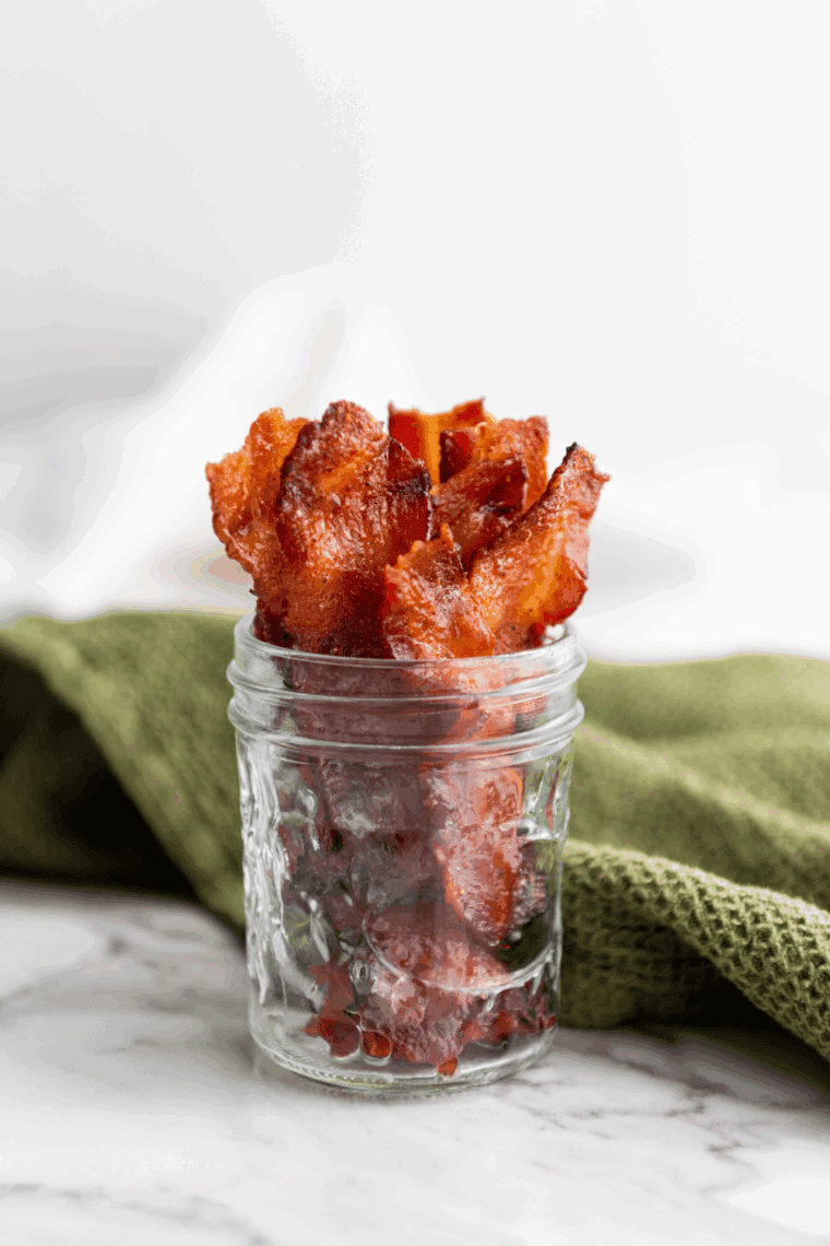 Air Fryer Bourbon Candied Bacon: Crispy bacon coated in a bourbon and brown sugar glaze, air-fried to golden perfection for a sweet and smoky treat.