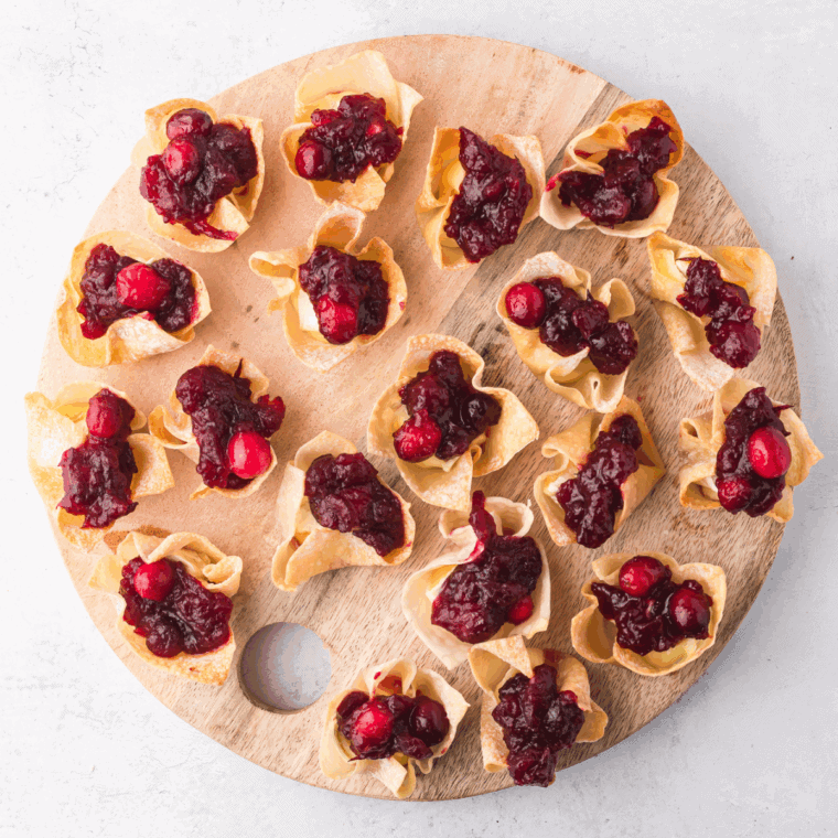 Air Fryer Cranberry Brie Bites with brie cheese, cranberry sauce, and crispy wonton wrapper.