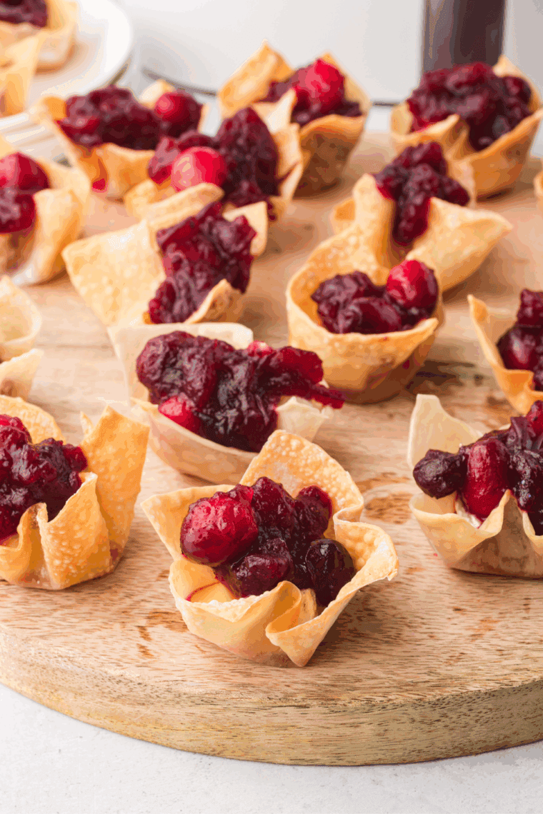 Air Fryer Cranberry Brie Bites with brie cheese, cranberry sauce, and crispy wonton wrapper.