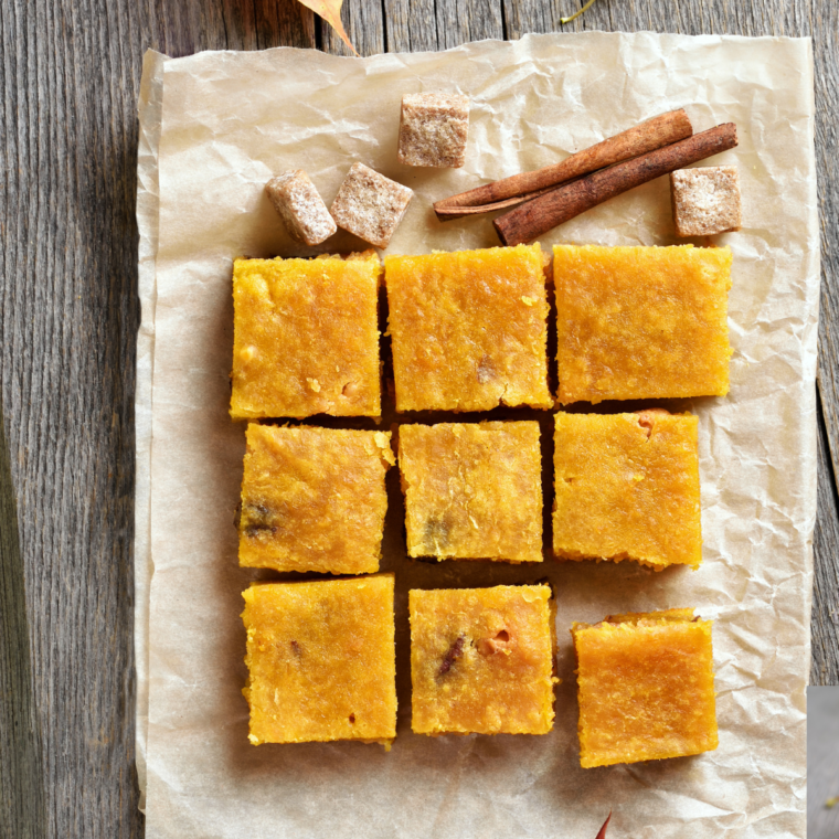 Air Fryer Pumpkin Pie Squares on a cutting board, with parchment paper.