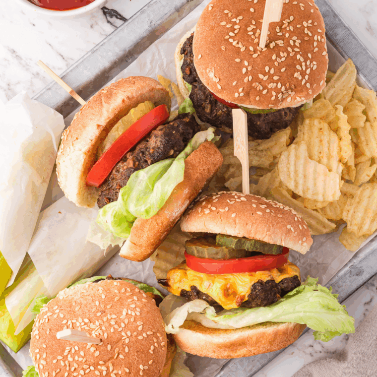 Homemade Copycat A&W Buddy Burger with juicy beef patty, cheese, pickles, and sauce.
