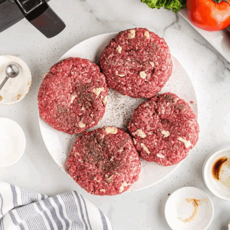 Shape burger patties, and place them on a plate.