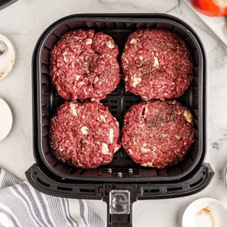 Place Copycat A&W Buddy Burger in the air fryer basket.