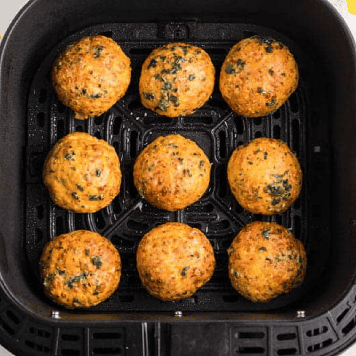 Golden Red Lobster-style biscuits cooked in the air fryer, served warm with melted butter and parsley on top.