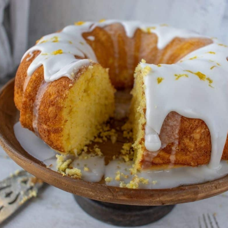 Sliced air fryer lemon bundt cake showing the moist yellow crumb