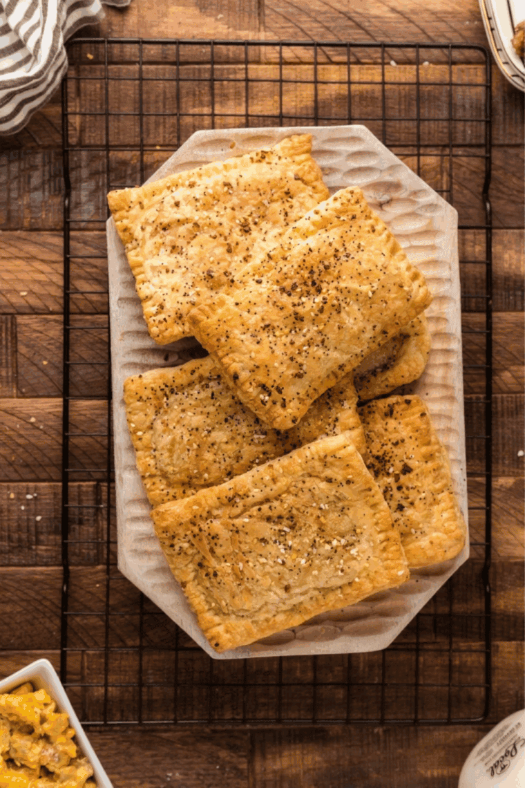 Air fryer sausage egg cheese toaster strudel with golden flaky crust on a plate