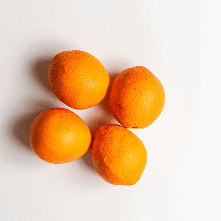Ingredients needed for Air Fryer Dried Orange Slices on kitchen table.