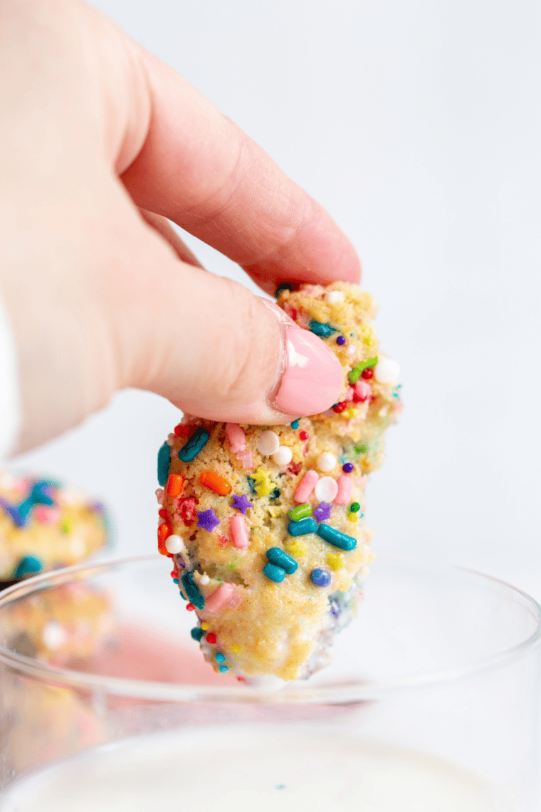 Golden, soft confetti cookies fresh from the air fryer, filled with colorful sprinkles.