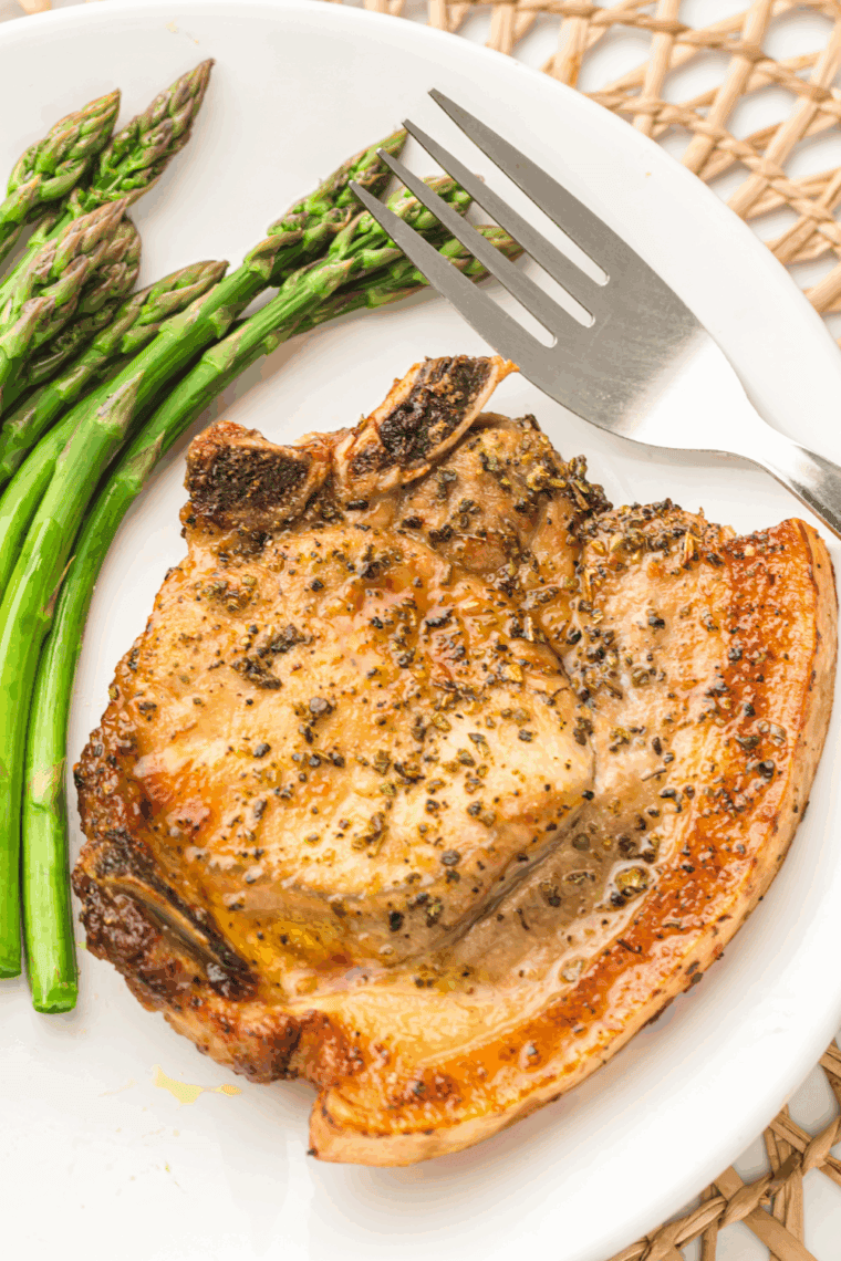 Perfectly cooked TGI Fridays-style Pepper Crusted Pork Chops, golden brown with a crispy, flavorful pepper crust.