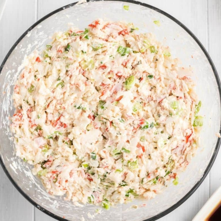 Filling in a bowl being mixed for Crab Rangoon Egg Rolls.