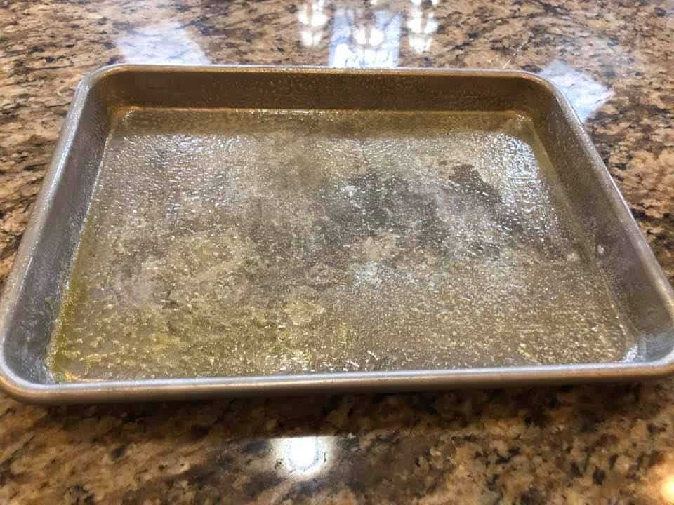 Start by spraying your sheet pan with olive oil.