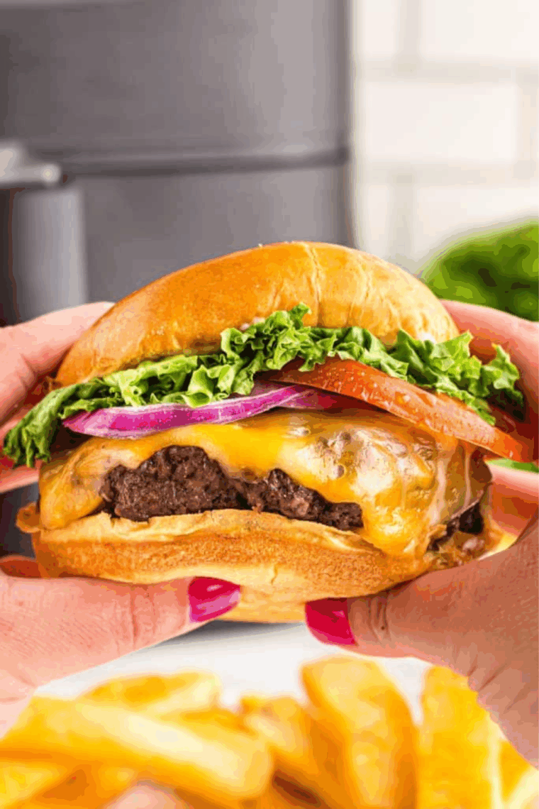 Homemade A&W Teen Burger stacked with beef patty, cheese, and fresh toppings.
