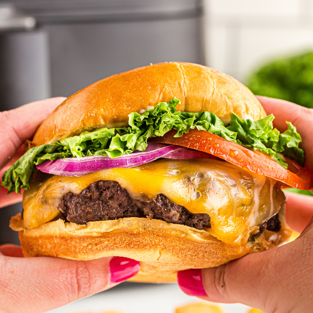 A&W Teen Burger copycat with cheese and pickles on a toasted bun