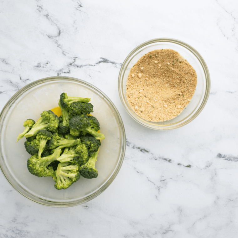  Broccoli florets coated in breadcrumbs and seasonings for air frying.