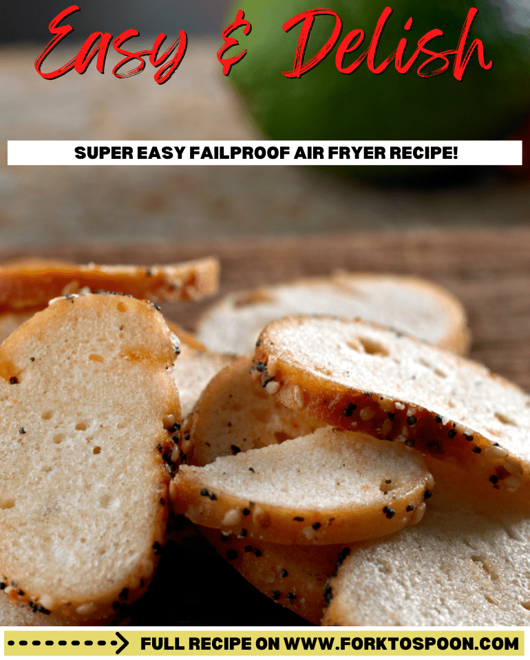 Pin for Air Fryer Bagel Chips.
Thin pieces of Air Fryer Bagel Chips are laying in a pile on a wooden surface., The bagels have seed coating the edge and are light golden in color.
Text overlay reads "easy & Delicious, super easy failproof air fryer recipe"