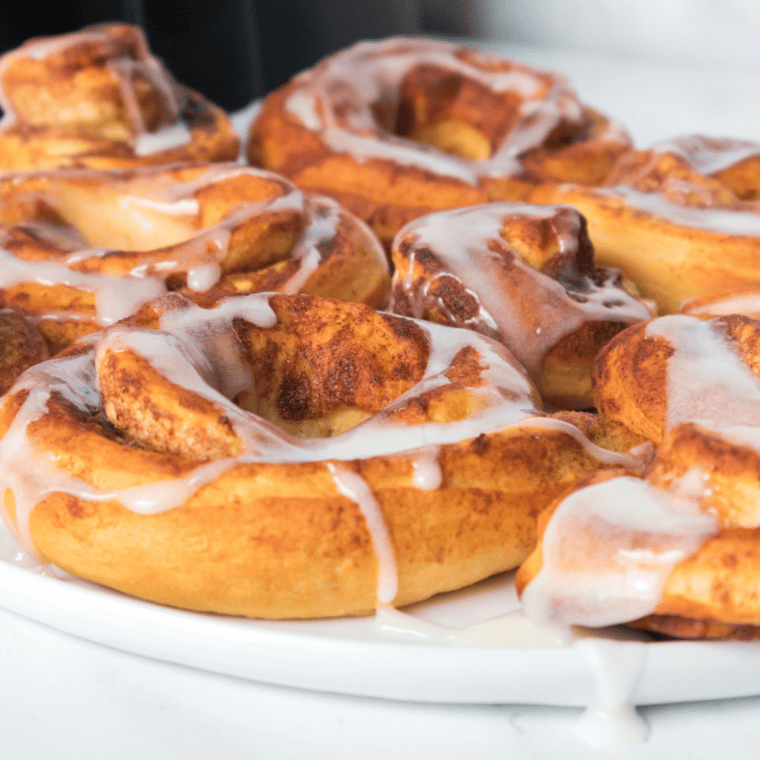 Plate of homemade Air Fryer Cinnamon Roll Donuts.