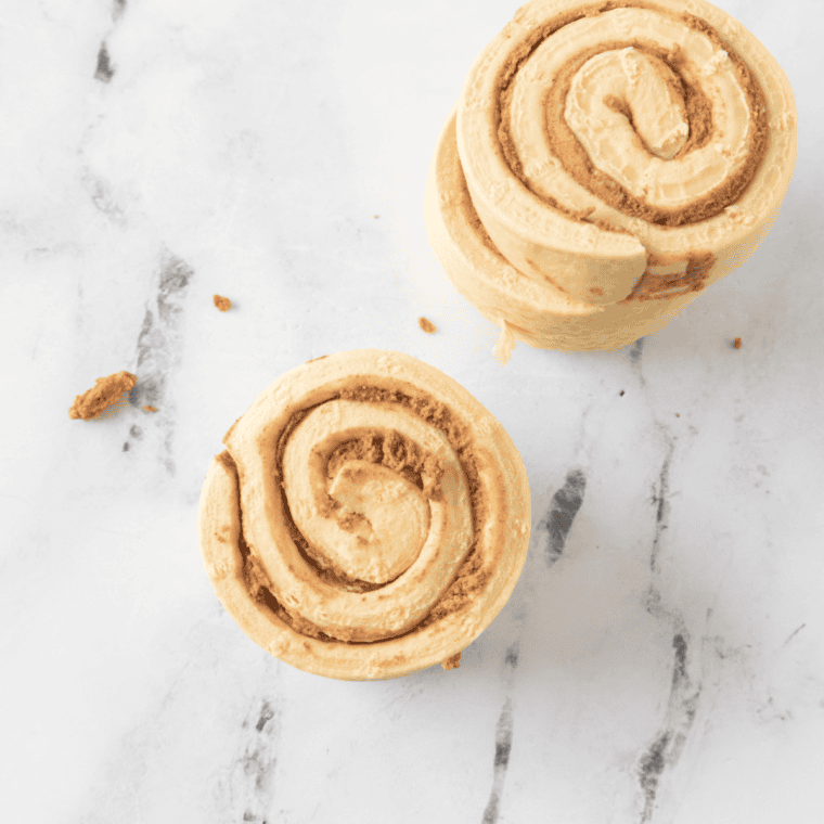 Unpackaged cinnamon rolls on the table.