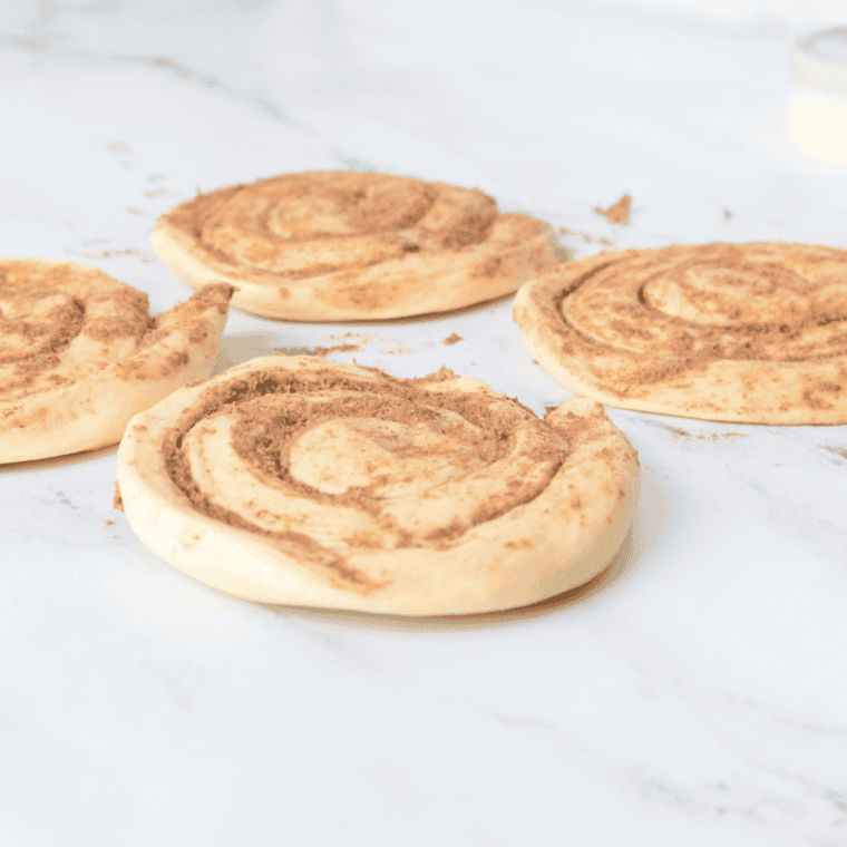 Use your hand or rolling pin, to flatten the biscuits.
