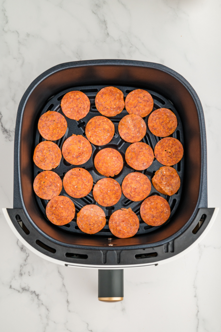 Place the pepperoni in a single layer in the air fryer basket.