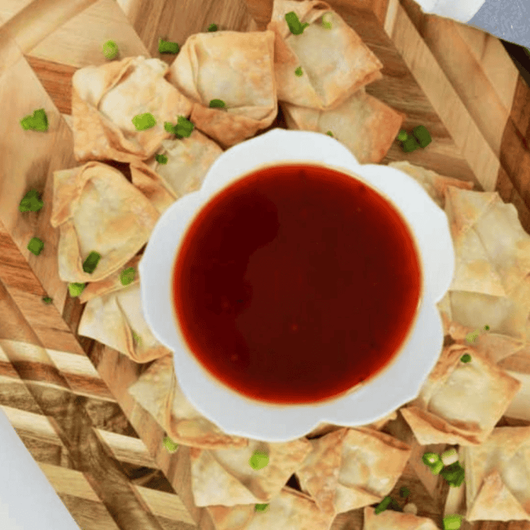 Crispy and golden Panda Express Cream Cheese Rangoon with a creamy cream cheese filling, served with dipping sauce.