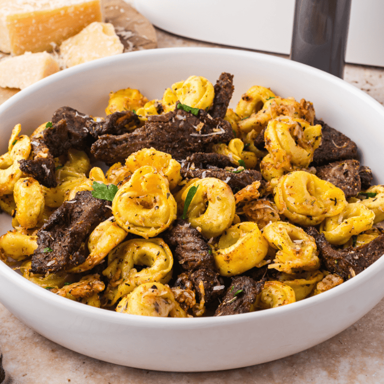 Air-fried Parmesan crusted steak with a crispy golden coating, served perfectly cooked and juicy on the inside.