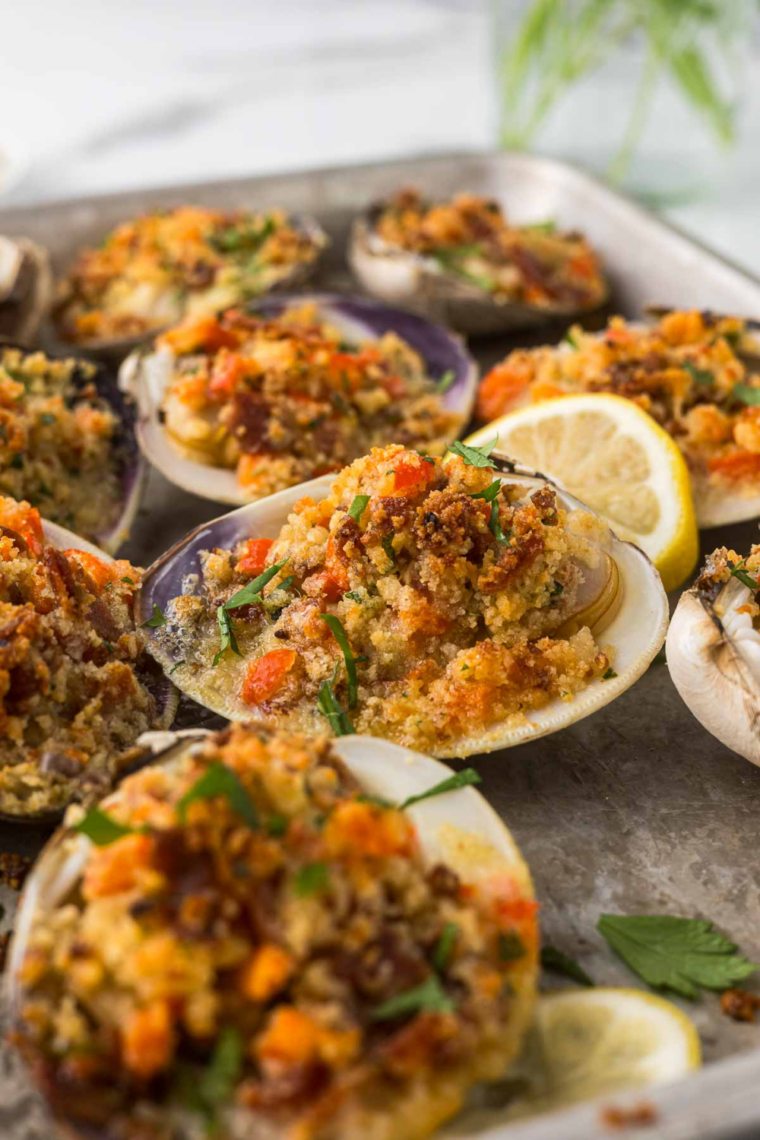 Plate of cooked air fryer stuffed clams (quahogs) with golden crisp tops