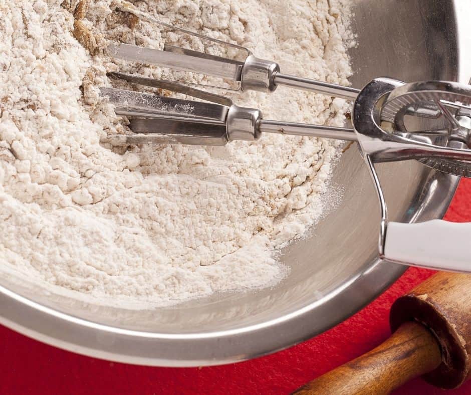 Start by working on the crust. You will add flour, powdered sugar, salt, and cornstarch into a food processor. Add in the butter and pulse. 