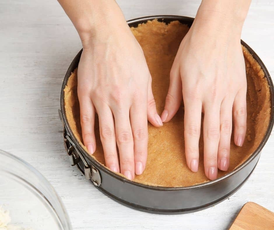 You want the mixture to be crumby little balls. Sprinkle the mixture into the pan and press it down firmly. Toss in the fridge for 30 minutes. 