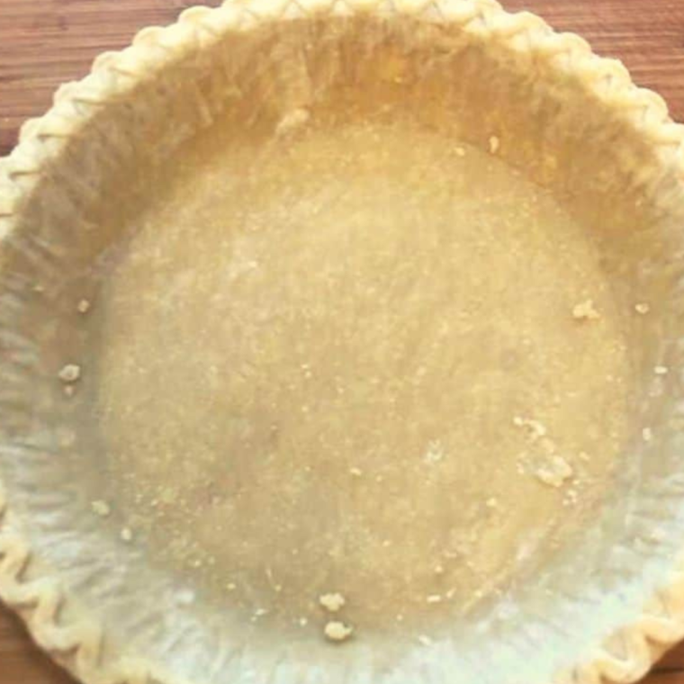 Frozen pie crust on cutting board, it is thawed for more even baking/cooking.