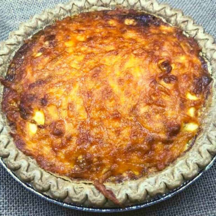 "Close-up of creamy, cheesy filling in Air Fryer Three Cheese Quiche"