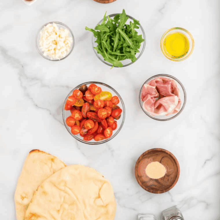 Ingredients needed for Easy Air Fryer Ham and Cheese Muffins on kitchen table.