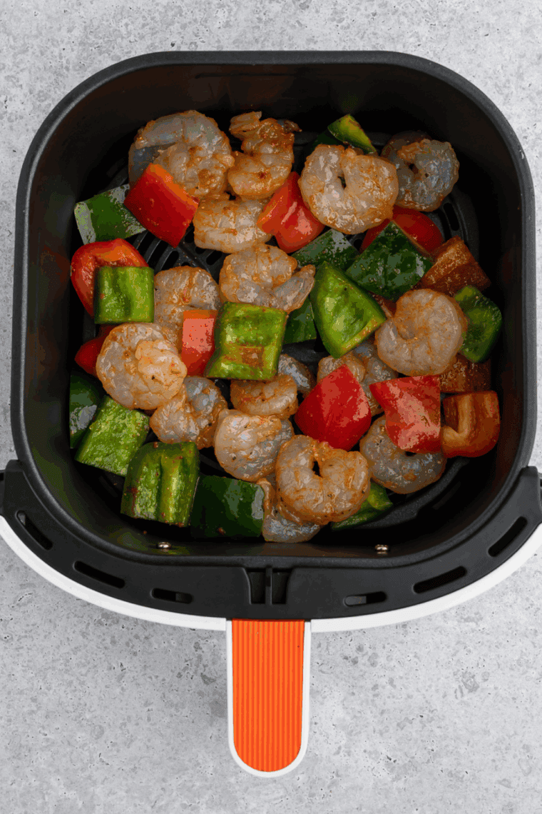 Preheat the Air Fryer: Air fryer set to 400°F (200°C) ready for cooking shrimp and vegetables.