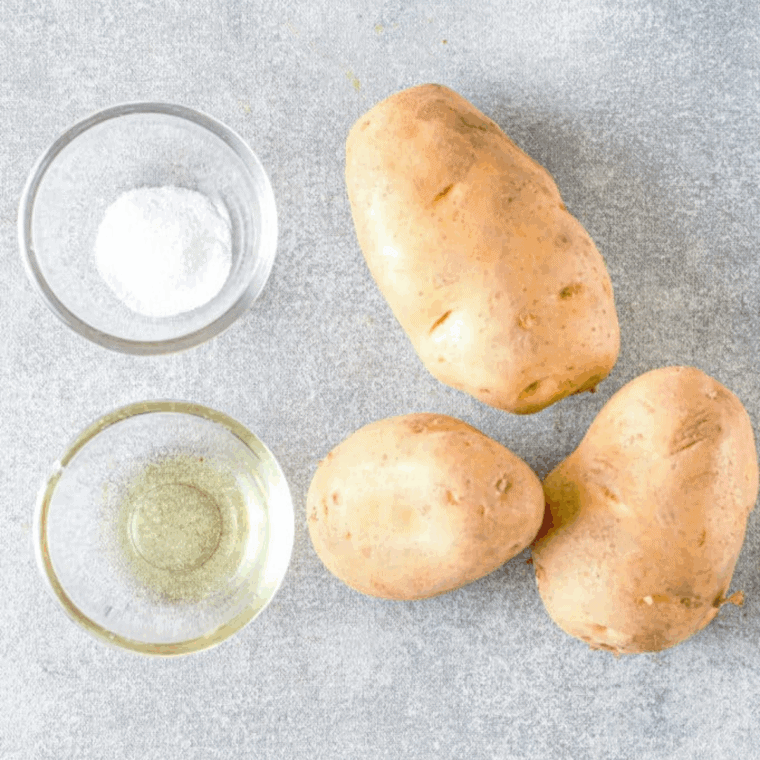 Ingredients needed for Easy Homemade Lay&rsquo;s Potato Chips Recipe on kitchen table.