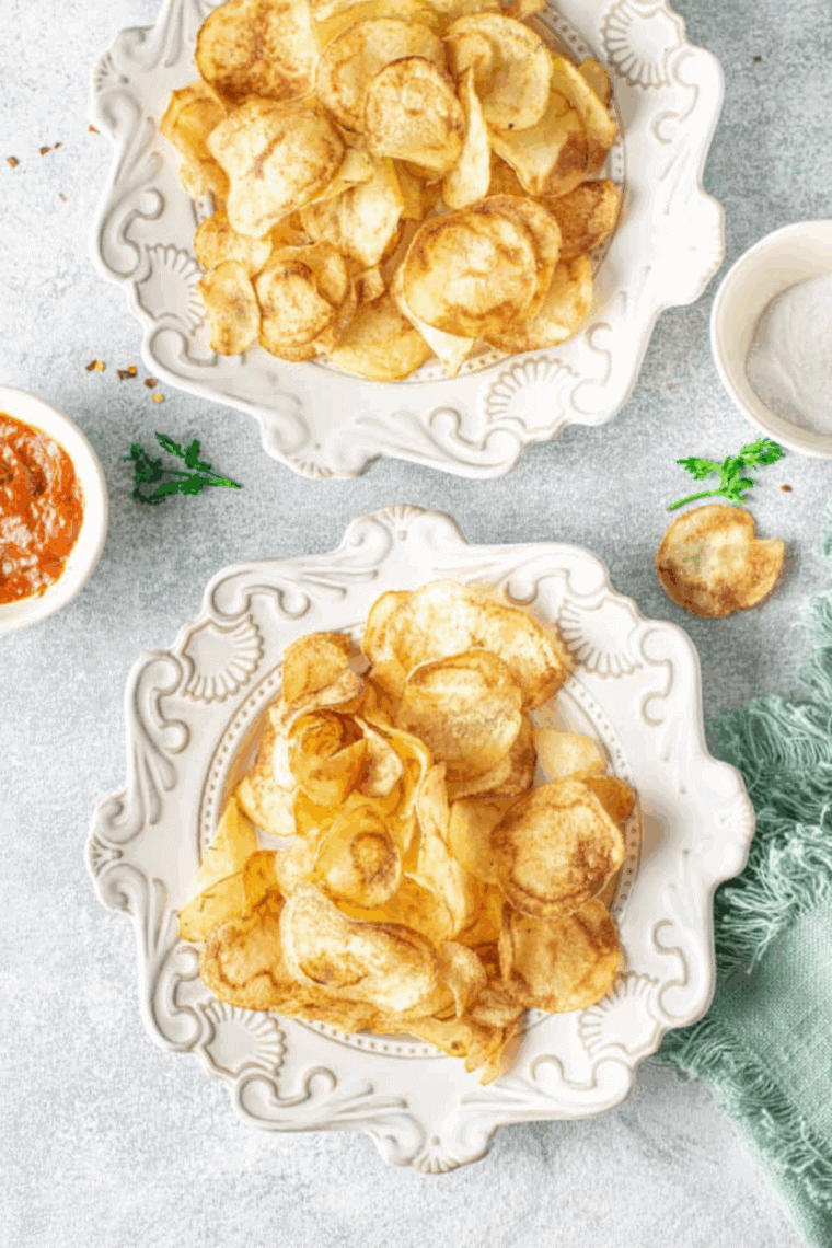 Golden, crispy air fryer homemade Lay&rsquo;s-style potato chips in a bowl.