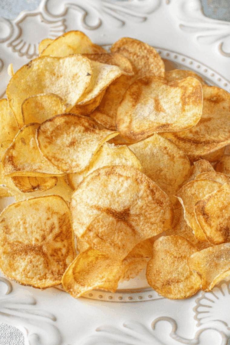 Crispy, golden air fryer homemade Lay&rsquo;s-style potato chips in a bowl.