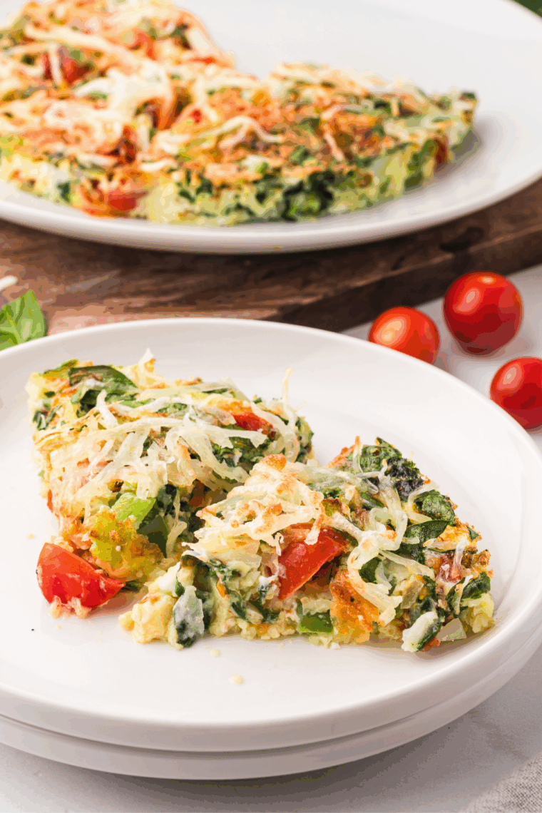 First Watch&rsquo;s Frittata Rustica served on a plate with vegetables and melted cheese, ready to enjoy for breakfast or brunch.