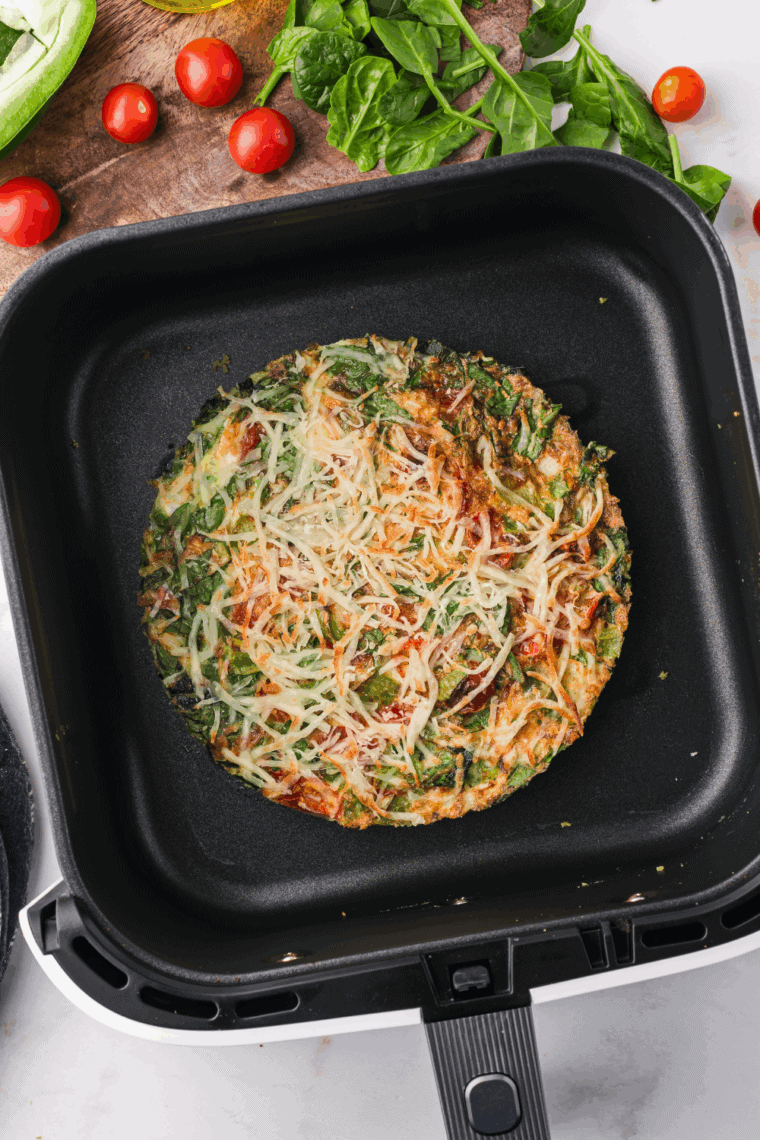 Testing the frittata&rsquo;s doneness with a toothpick inserted in the center.