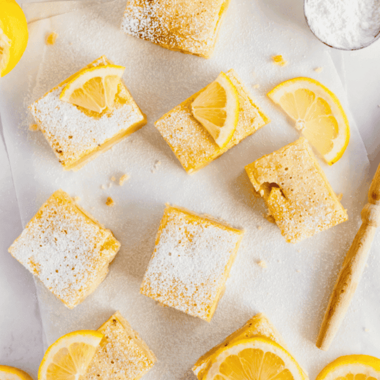 Lemon protein bars cut into squares, showcasing bright lemon flavor and chewy, protein-packed texture.
