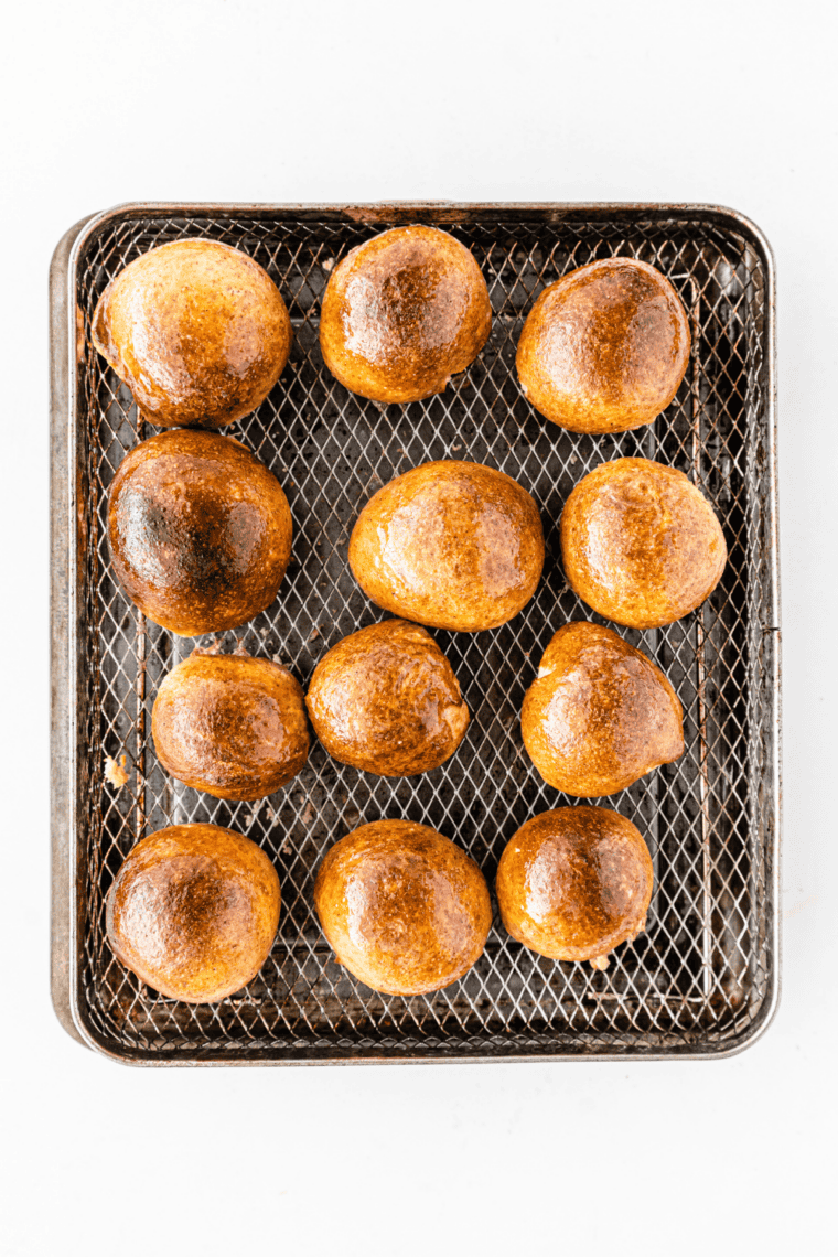 Plate of homemade soft pretzel bites brushed with butter and sprinkled with coarse salt, served warm for snacking and dipping.