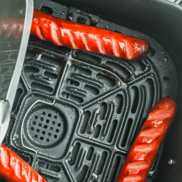 Cooked Coney Cheese Dog Recipe in the air fryer basket.
