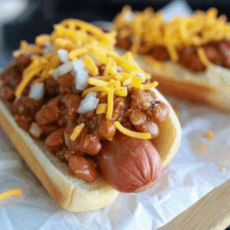 A&W Coney Cheese Dog topped with chili and melted cheddar cheese.