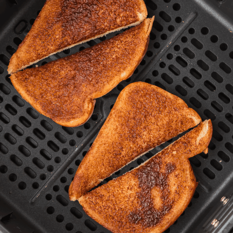 Placing bread slices in the air fryer basket, setting temperature to 375°F to toast until golden and crispy.