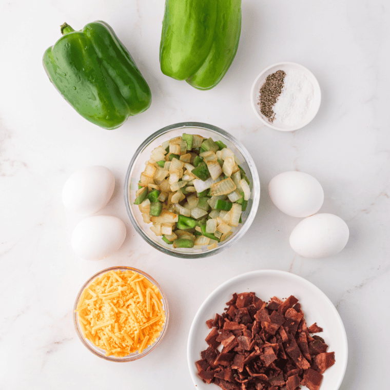 Ingredients needed for Air Fryer Breakfast Stuffed Peppers on kitchen table.