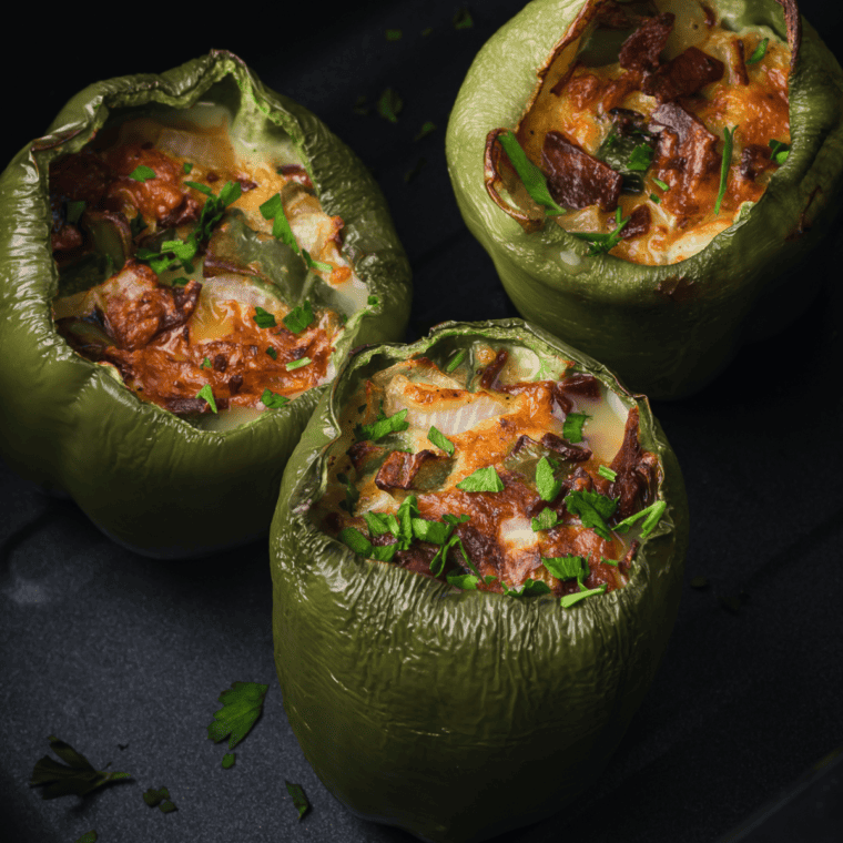 Air Fryer Breakfast Stuffed Peppers with eggs, cheese, and veggies, freshly cooked and ready to serve.