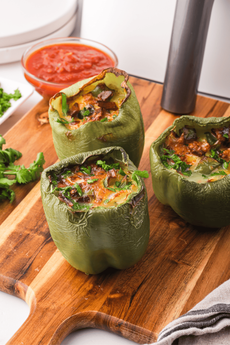 Air Fryer Breakfast Stuffed Peppers filled with eggs, cheese, and veggies, served hot and ready to eat.