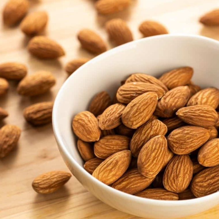 Ingredients needed for Air Fryer Candied Almonds on kitchen table.