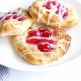 Air Fryer Cherry Cream Cheese Danish with flaky pastry, cream cheese filling, and cherry topping.