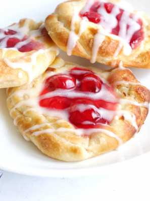 Air Fryer Cherry Cream Cheese Danish with flaky pastry, cream cheese filling, and cherry topping.