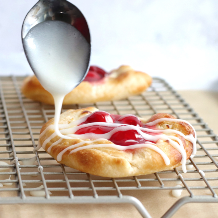 Golden and crispy Air Fryer Cherry Cream Cheese Danish with cream cheese filling and cherry topping.