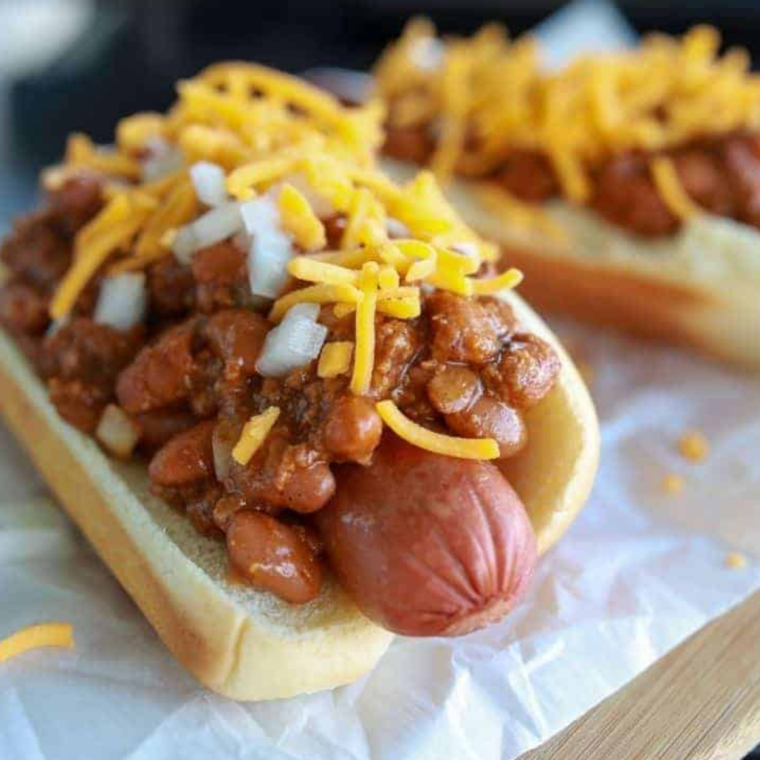 Close-Up of Chili Cheese Hot Dog - A close-up shot highlighting the melted cheese and chili on a hot dog